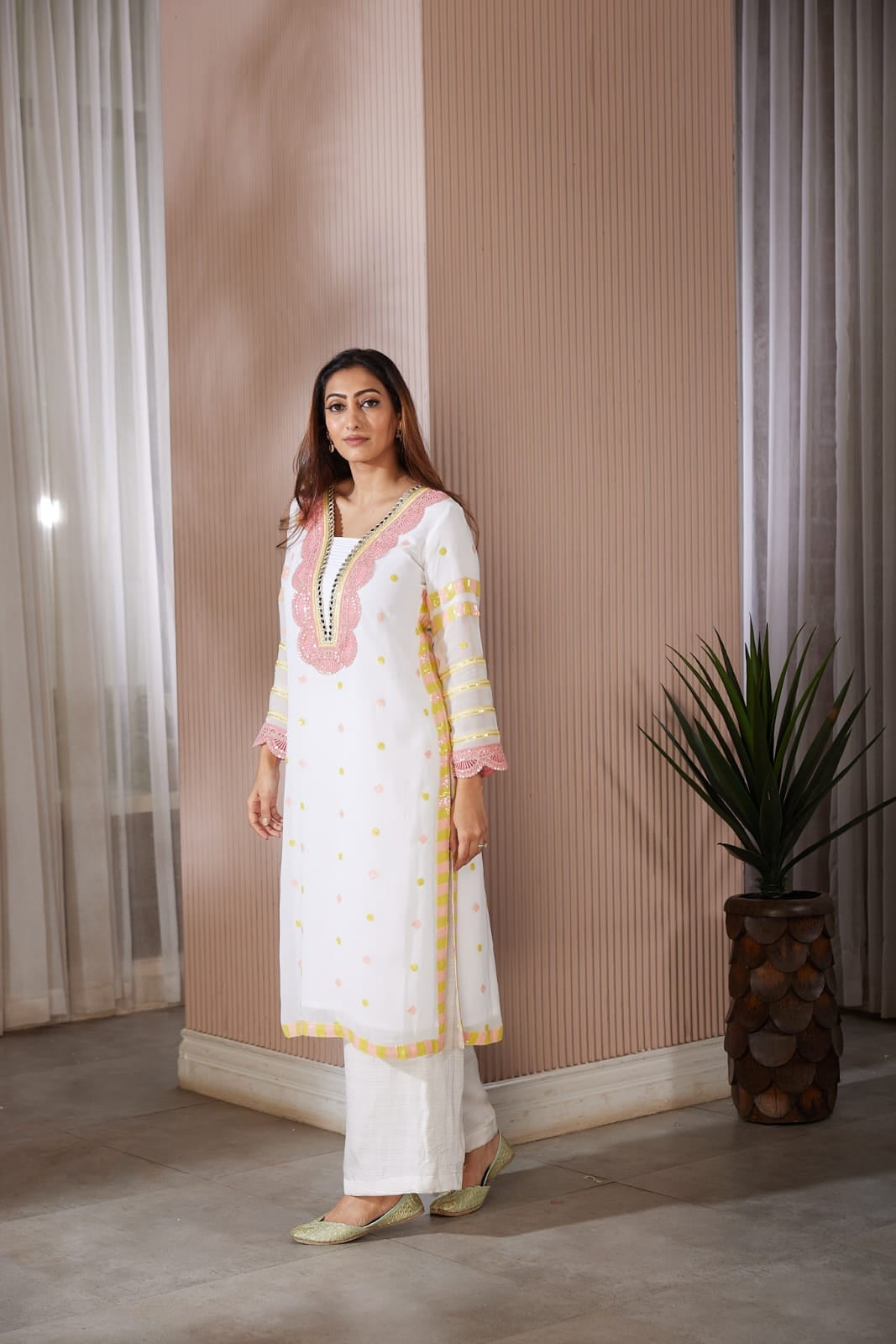 Long kurta with beautiful code dori and mirror work top and side finished with sequence work along with a straight plazzo pants