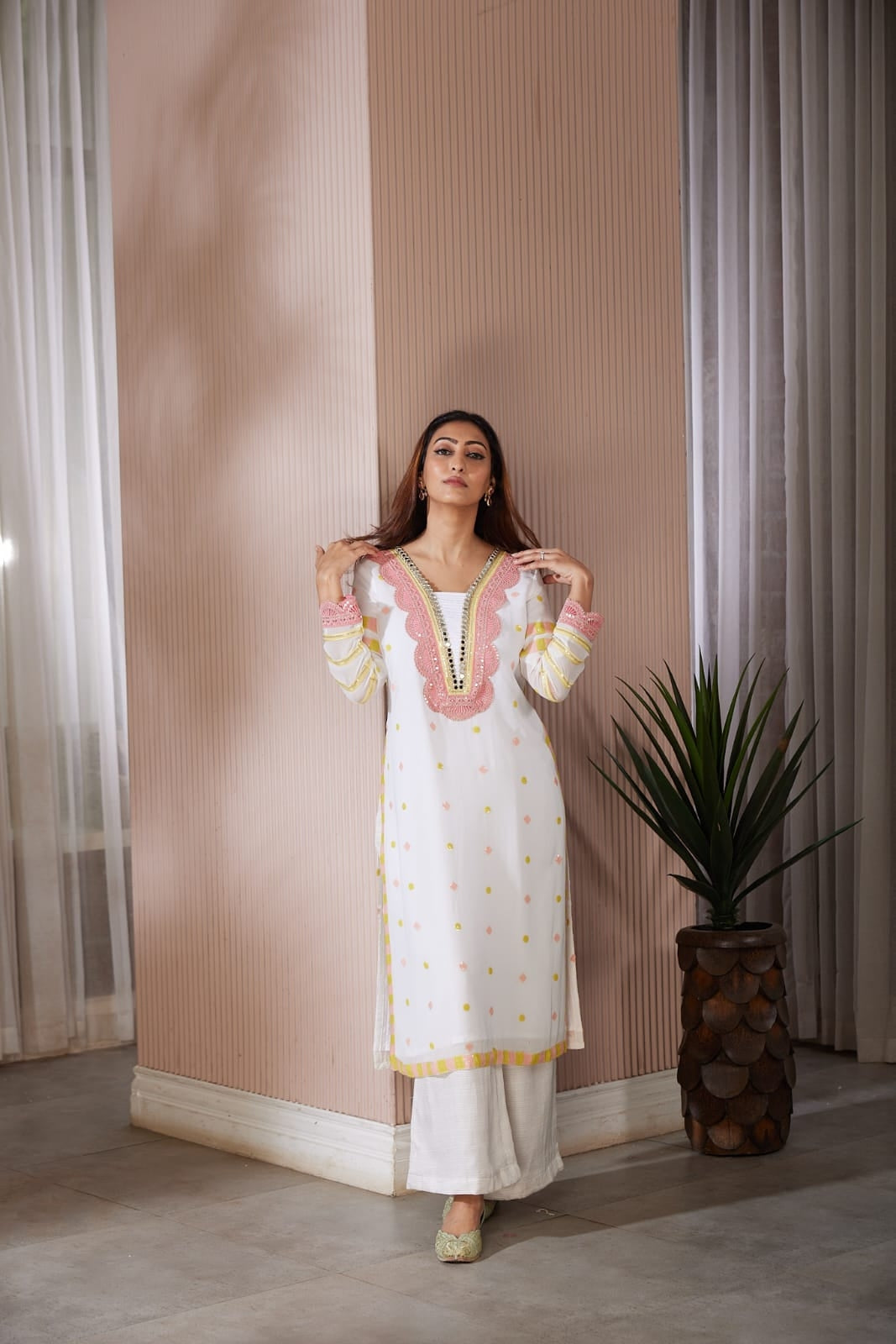 Long kurta with beautiful code dori and mirror work top and side finished with sequence work along with a straight plazzo pants