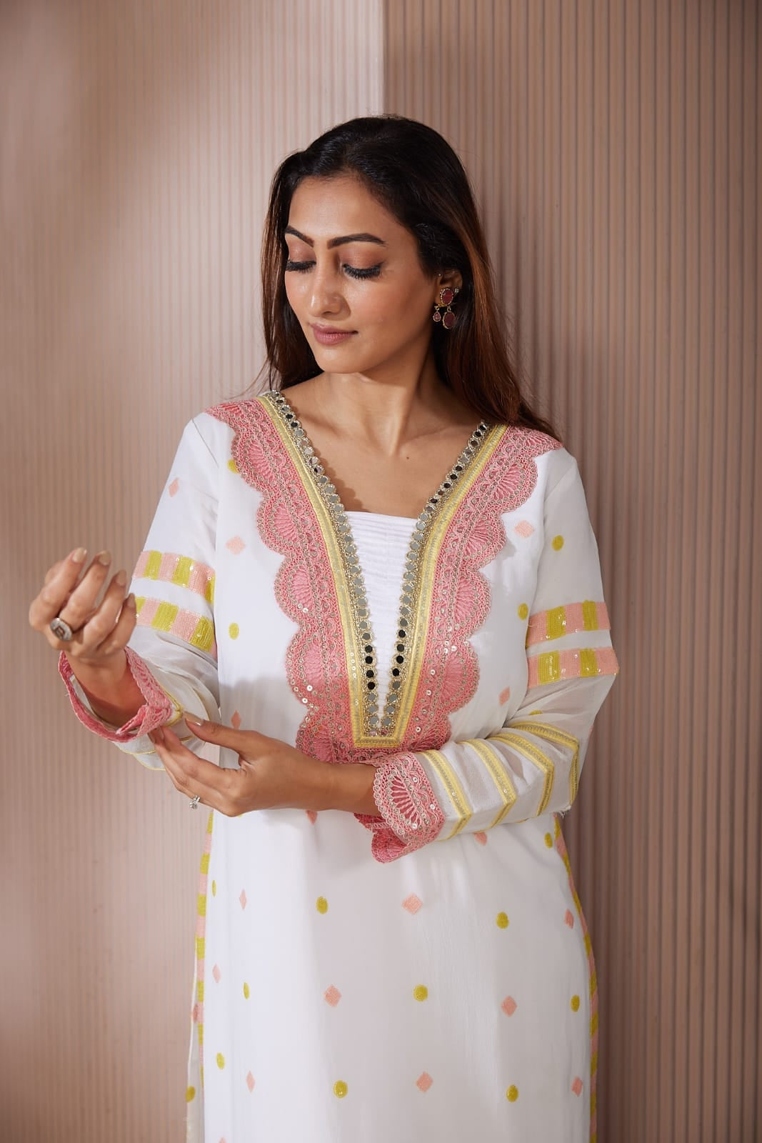 Long kurta with beautiful code dori and mirror work top and side finished with sequence work along with a straight plazzo pants
