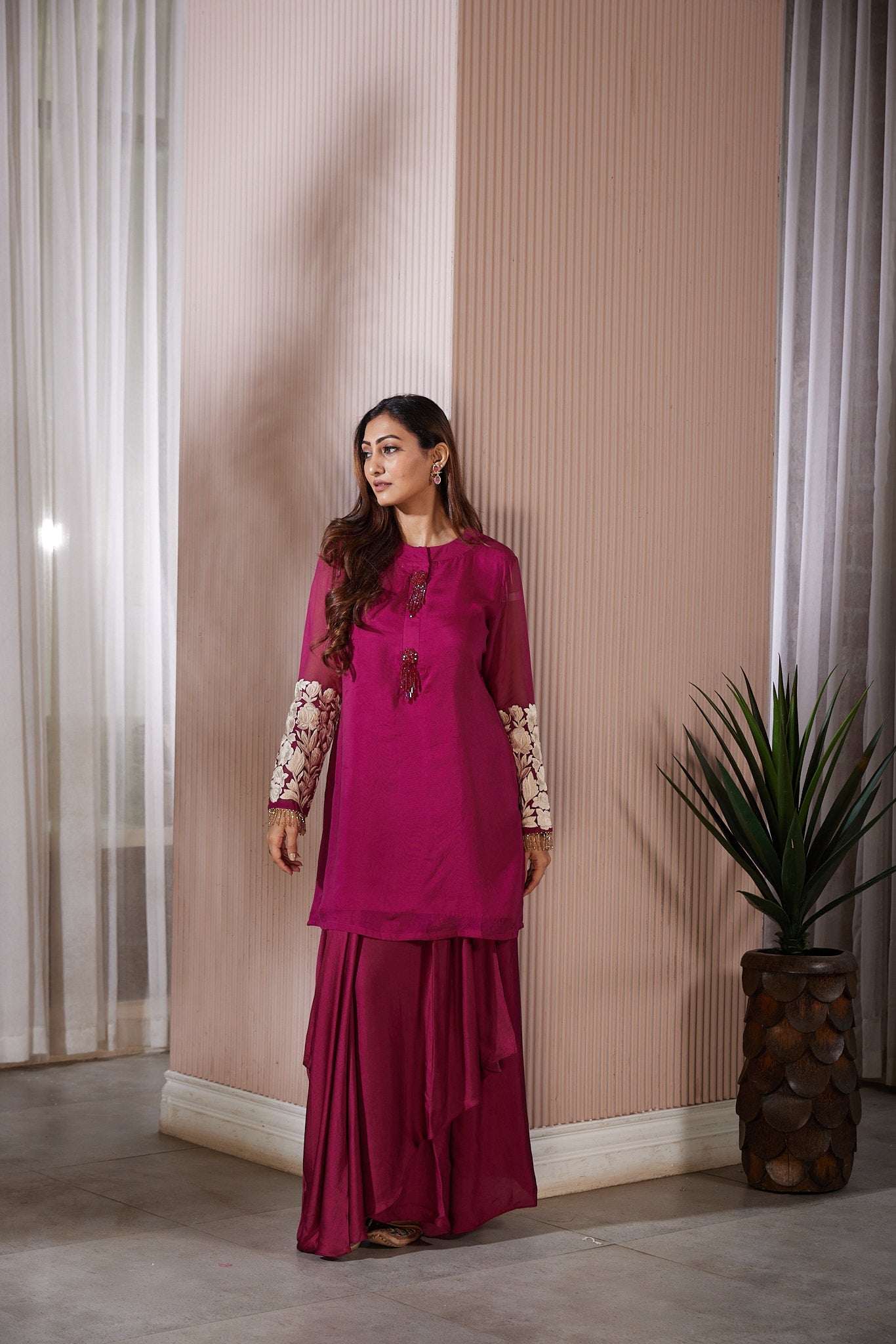 Long skirt with elegant drapes with a short kurti sleeves fully Resham worked with crystal hangings