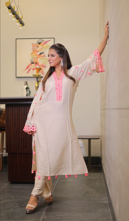 Long kurta with high neck cut work in the neck and sleeves straight pants with cuts on the side