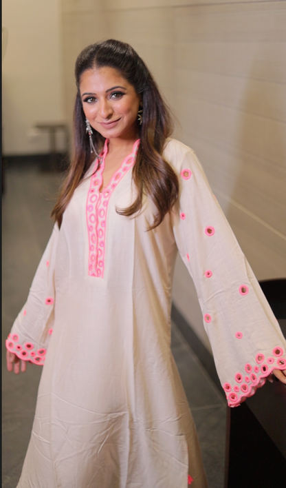 Long kurta with high neck cut work in the neck and sleeves straight pants with cuts on the side