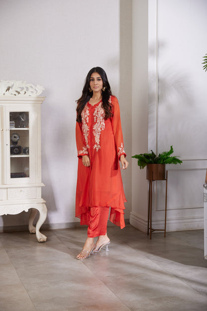 A top cut in an IndoWestern asymmetrical style with beautiful Resham pearl and cutdana handwork