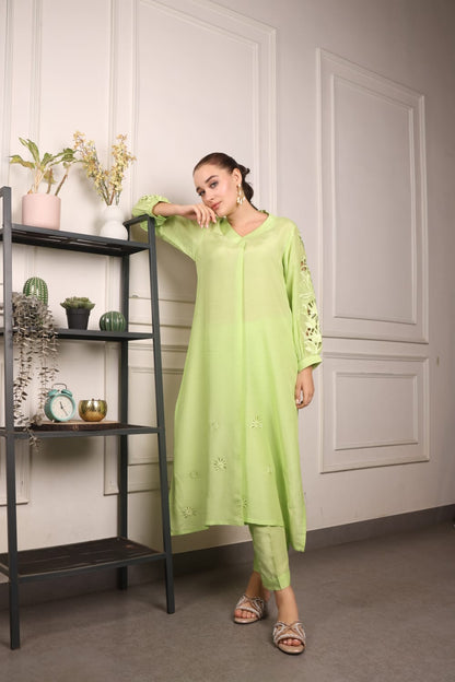 Long kurta and straight pants with cutwork sleeves and work in the Daman