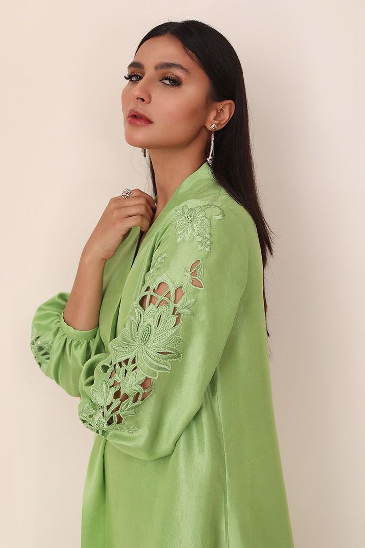 Long kurta and straight pants with cutwork sleeves and work in the Daman