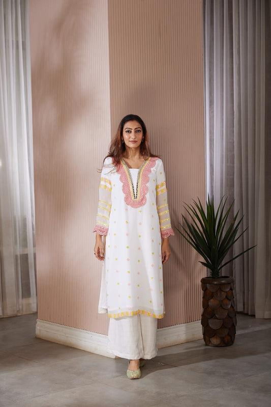 Long kurta with beautiful code dori and mirror work top and side finished with sequence work along with a straight plazzo pants