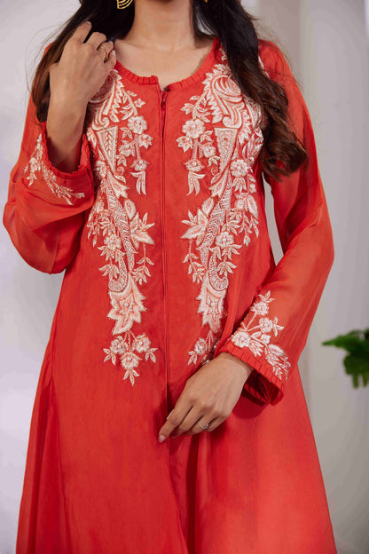 A top cut in an IndoWestern asymmetrical style with beautiful Resham pearl and cutdana handwork