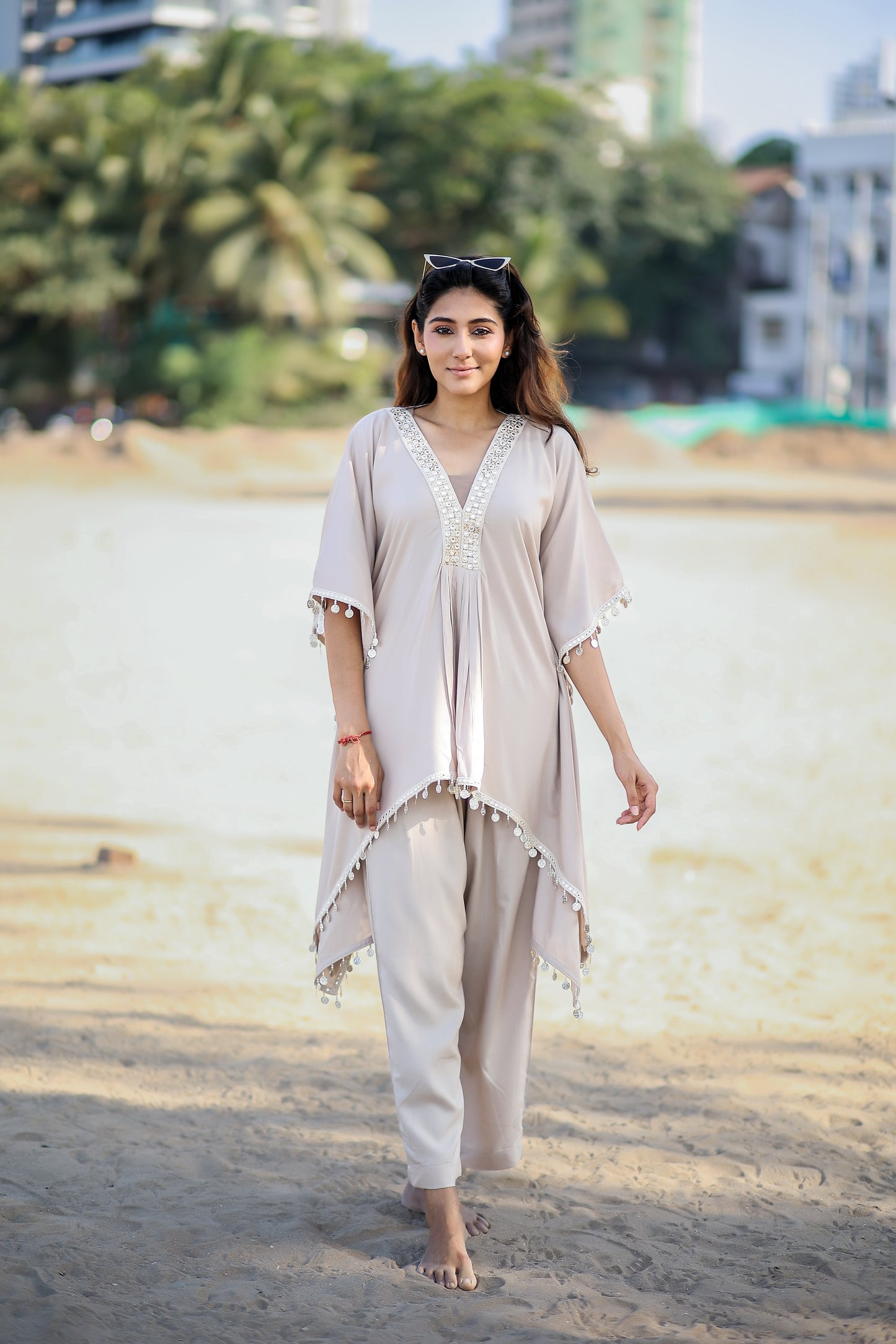 V neck with gathers kaftan kurti with white and gold work and latkan